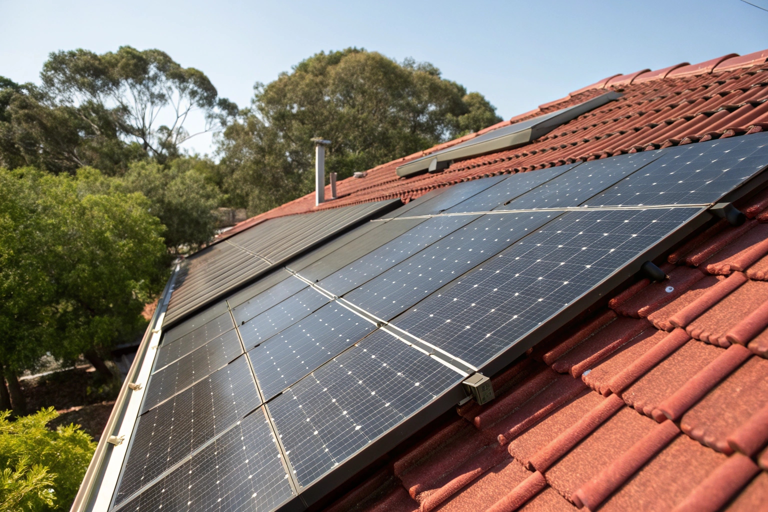 close-up-view-of-black-solar-panels-on-red-tile-ro